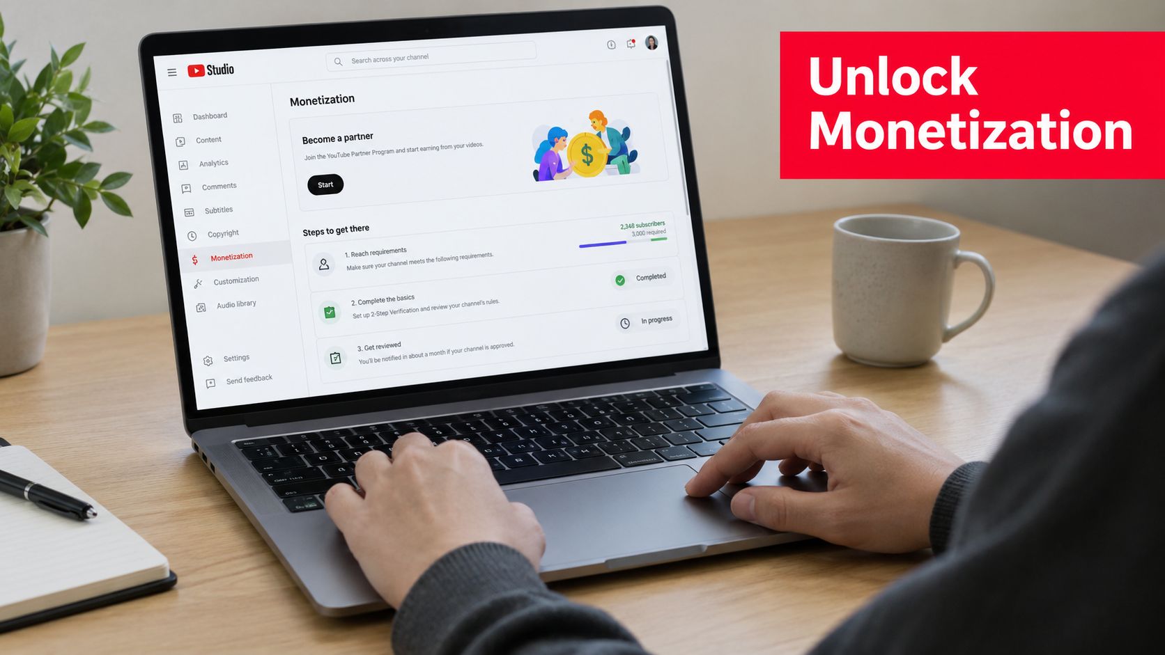 A person using a laptop to view the YouTube Studio monetization page with progress tracking subscriber requirements.
